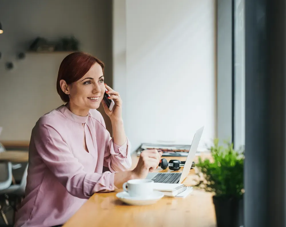 A Staff-IT team member on the phone with a referrer